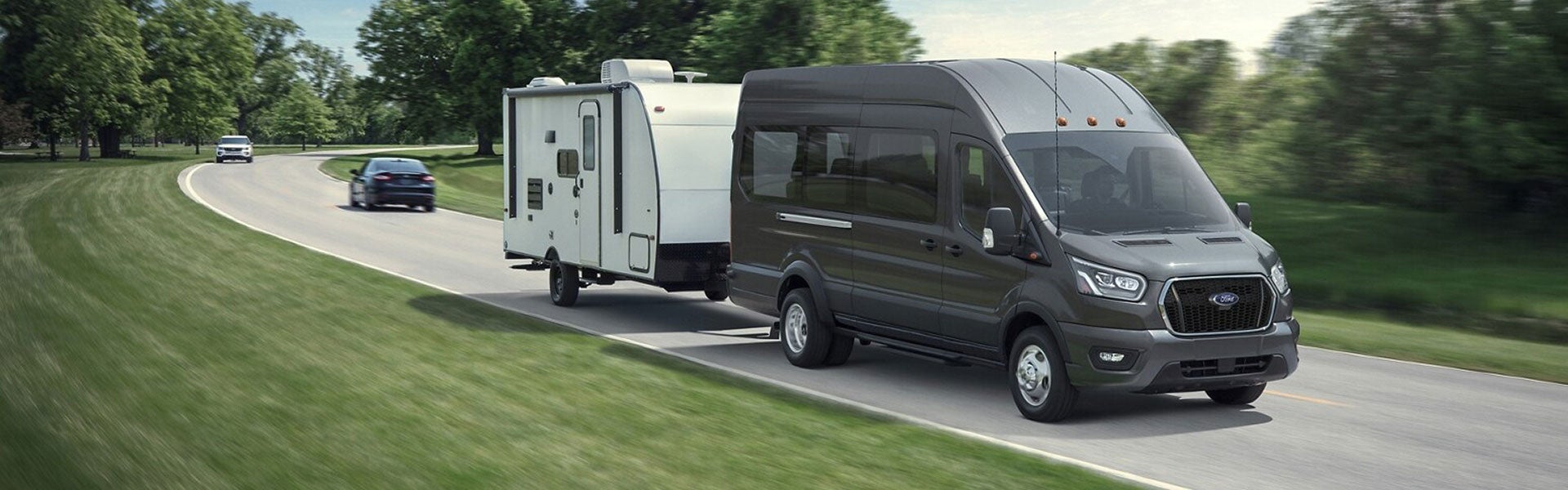 Ford Transit Passenger Wagon towing a camper trailer