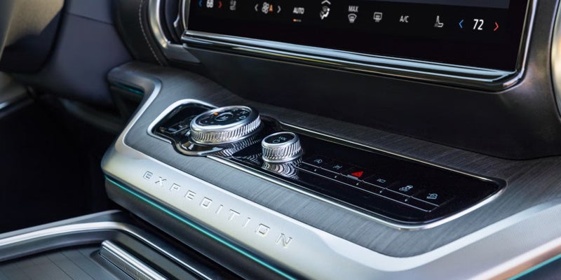 Center console dial controls and touchscreen inside Ford Expedition