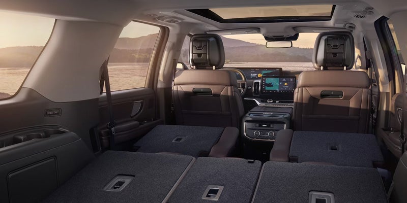 Interior cabin view looking forward from folded rear seats in Ford Expedition