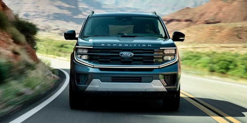 Front view of Ford Expedition driving on road