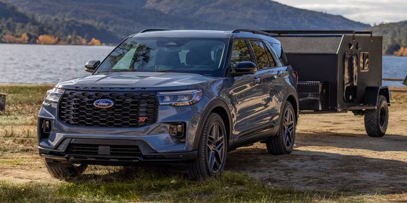 Ford Explorer SUV parked outdoors with a trailer