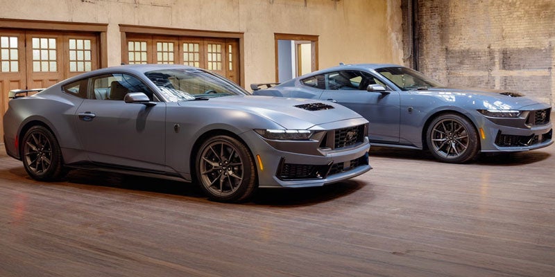 Ford Mustang coupes parked side-by-side