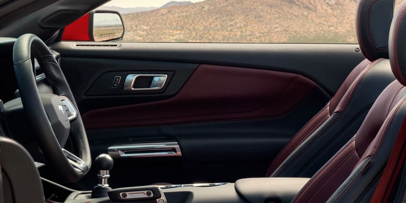 Interior driver seat and dashboard of Ford Mustang