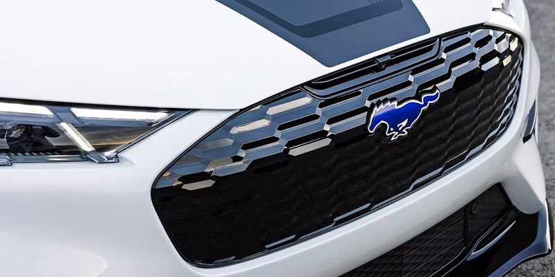 Close-up of Ford Mustang Mach-E front grille badge