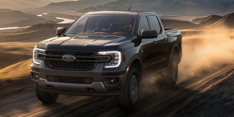 Ford Ranger driving through dust